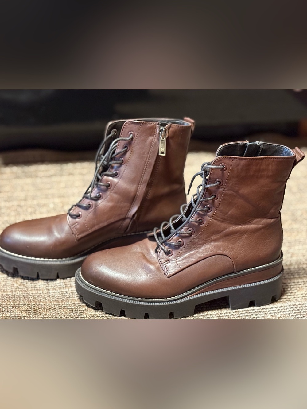 Dark brown , Sam Edelman combat boots with lug sole and working side zipper.